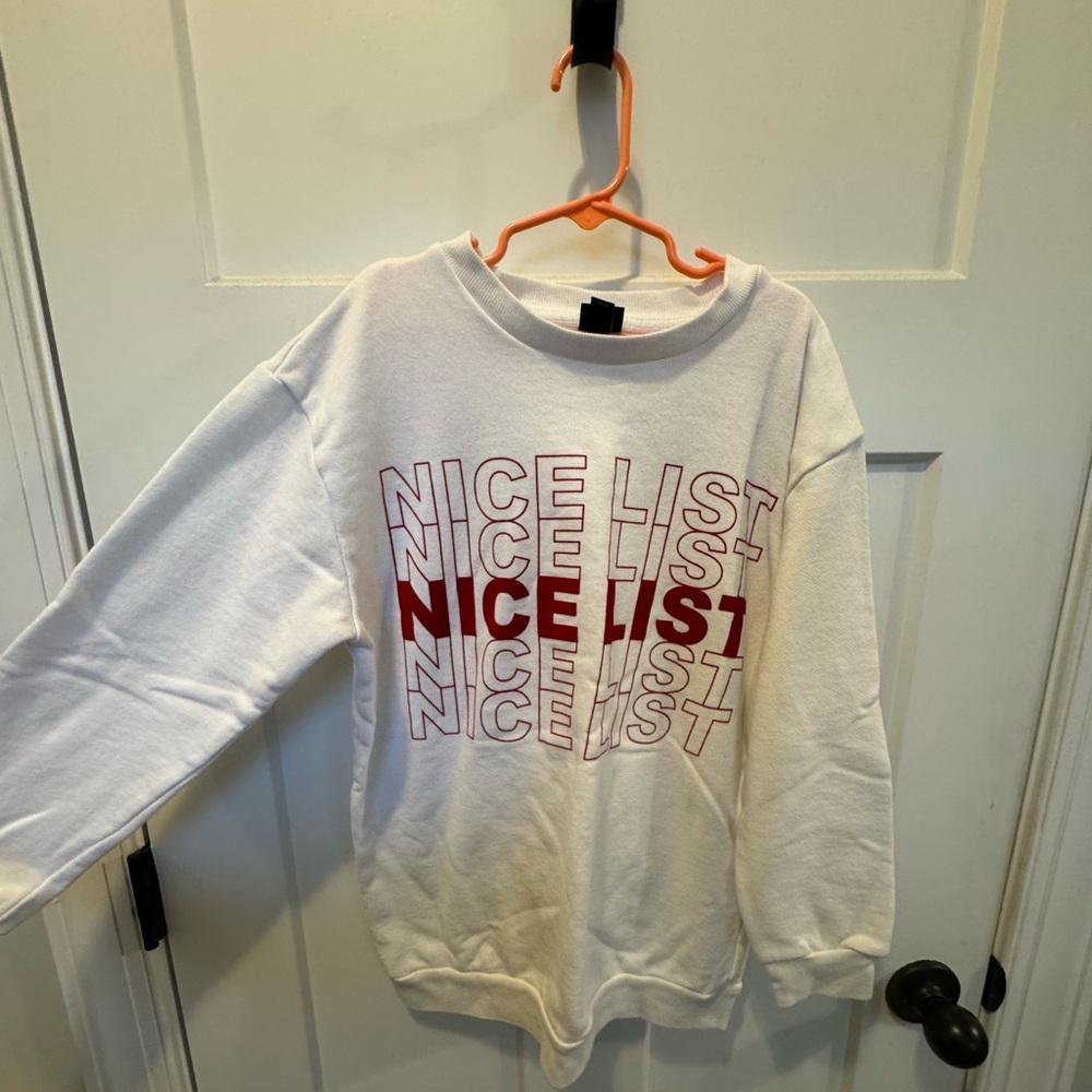 Nice List Kids Christmas Sweatshirt with Red writing.